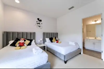 a bedroom with two beds with a teddy bear on them at 65 Home At Sonoma Resort, Private Pool, And Much More!! in Kissimmee
