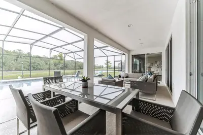a dining room with a table and chairs at 65 Home At Sonoma Resort, Private Pool, And Much More!! in Kissimmee