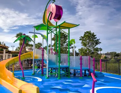 a water park with a water slide in a pool at Charming 3BR Townhome Private Pool Walk to Clubhouse 9 Min Disney in Orlando