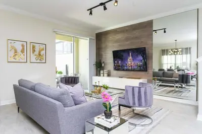 a living room with a couch and two chairs at Amazing Villa 5BR Heated Pool Themed Rooms - 5 miles Disney in Kissimmee